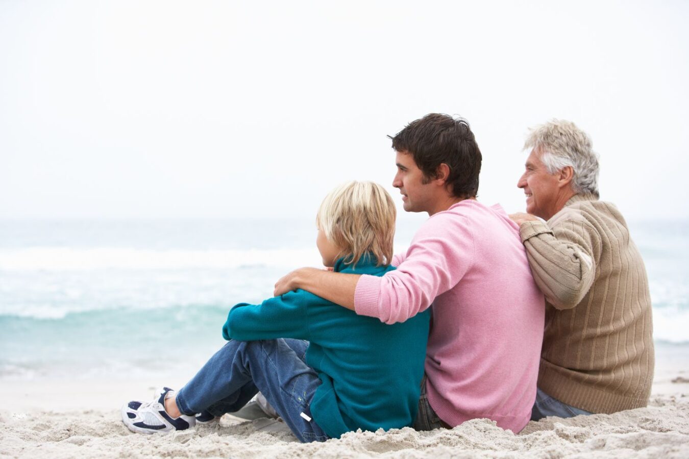shutterstock_57925066 | South Padre Island Vacation Rentals Family sits on beach in winter