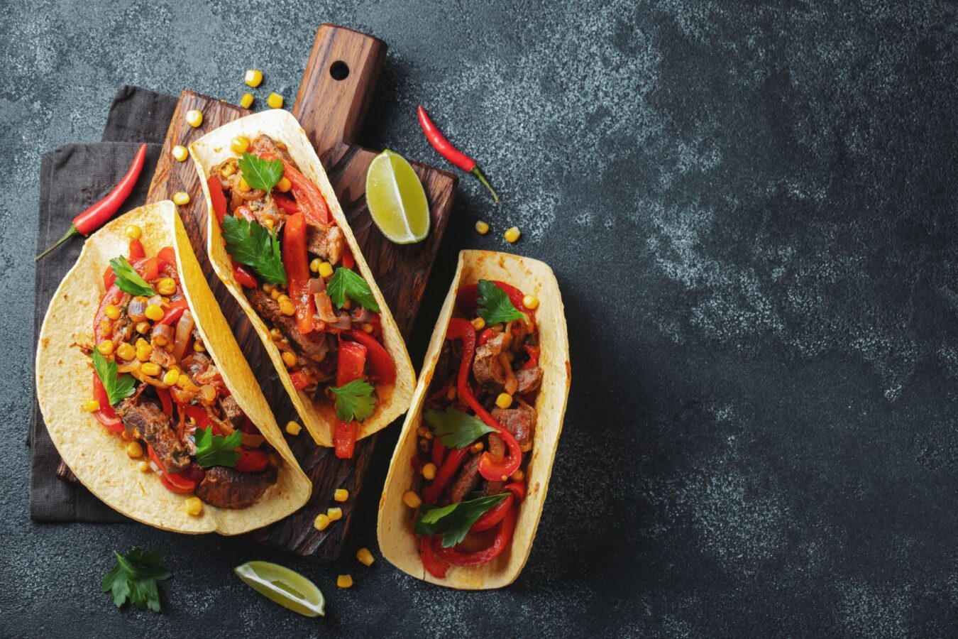 tacos-shutterstock-1600 | South Padre Island Vacation Rentals tacos with fixings on a wooden platter