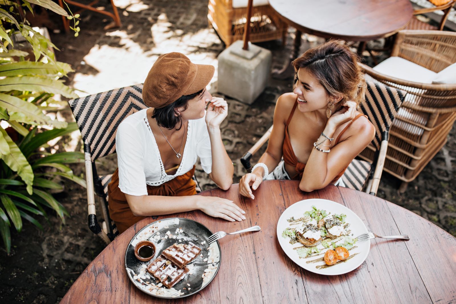 two women eating a meal together at a restaurant