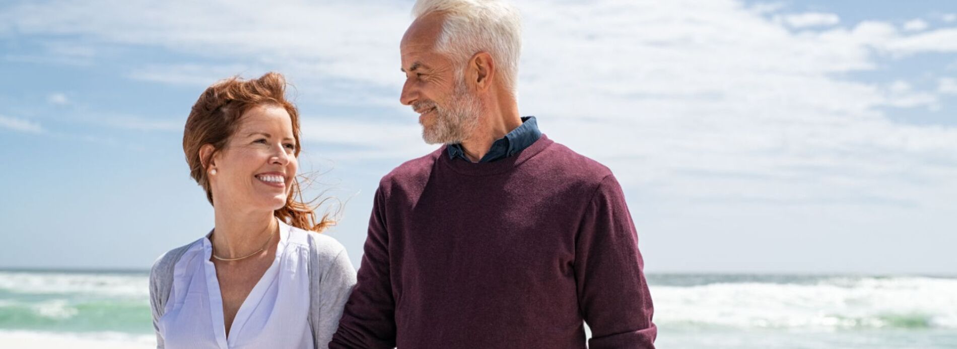 Mature couple on beach in winter