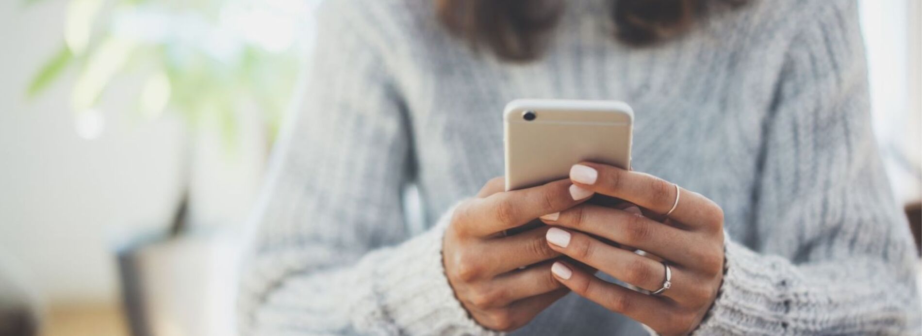 woman holding cell phone
