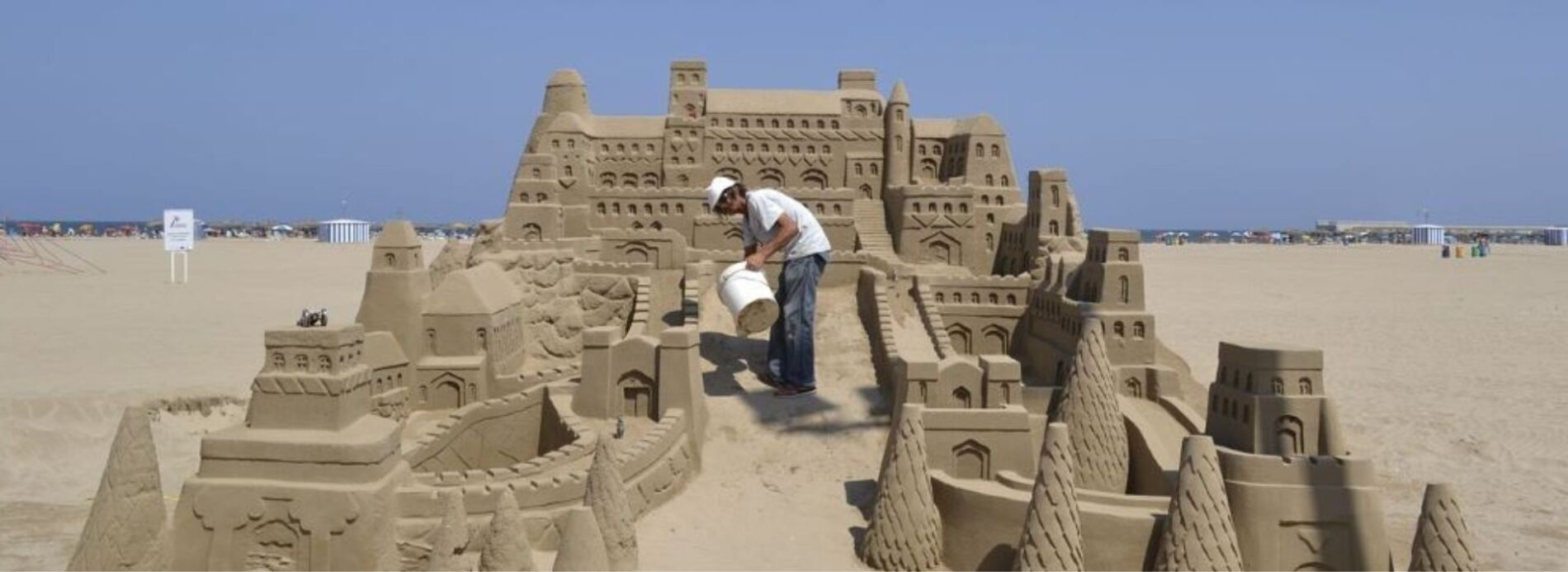 Man building large sandcastle