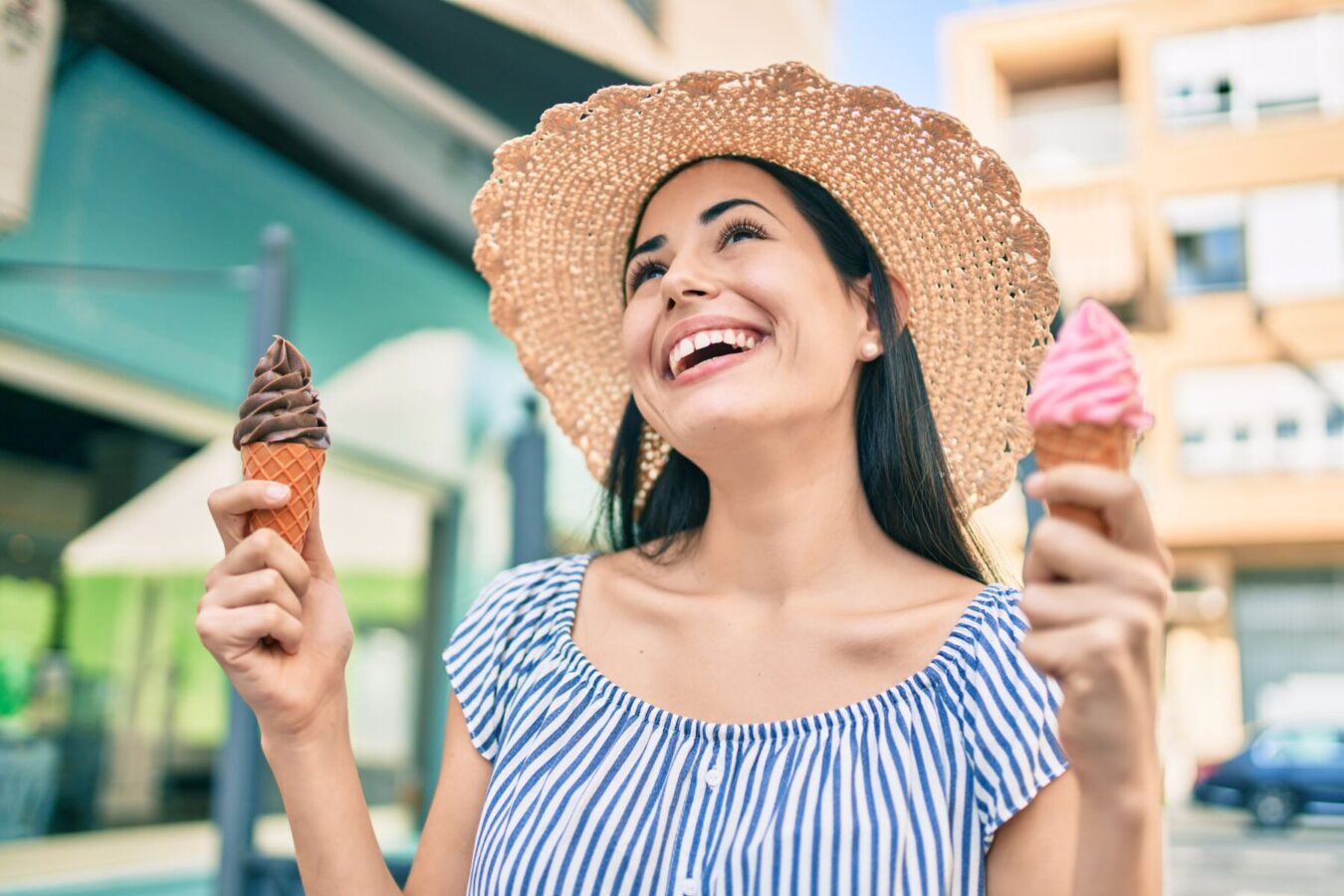 Visiting-local-beachfront-ice-cream-parlors | South Padre Island Vacation Rentals Young woman holding ice cream cones